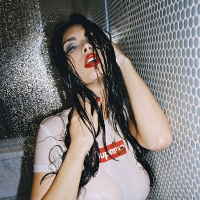 Tera Patrick posing and getting her Tshirt wet