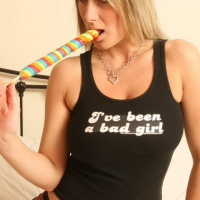 Pictures of busty schoolgirl Demi sucking her lollipop in bed
