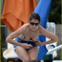 Katie Holmes wearing a bikini top and denim shorts in Miami