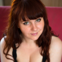 Sexy redhead girl Katrin Porto unveils her big boobies