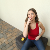 Attractive GF Molly Jane smokes and flashes her big natural boobs
