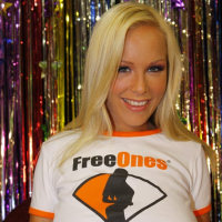 Jessica Moore posing sexy in a FreeOnes TShirt