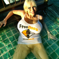 Busty Sandra Star almost bursts out of a FreeOnes Shirt