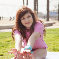 Redhead coed Ellena Woods invites you to have some fun with her on the beach