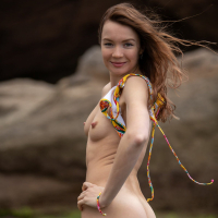Solo petite cutie Janeth Tense posing in a colorful bikini outdoors