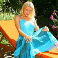 Beautiful Jessie in a long blue summer dress and sexy white stockings