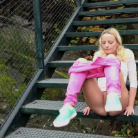 Amy Pink in tight pink pants taking a leak