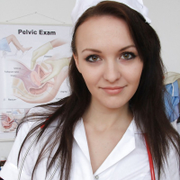 Stunning nurse brunette Belle spreading her mouth and pink pussy
