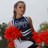 Teen cheerleader Dani Daniels pulls up her skirt to toy her gloryhole