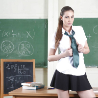 Clothed babe Connie Carter is showing off in a school uniform