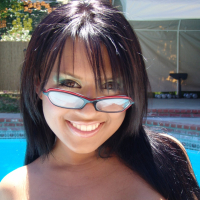 Busty bikini beauty Eva Angelina is having fun stripping in the pool