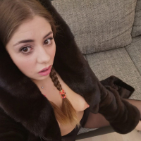 Hot brunette Julia Red masturbates on the sofa