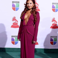 Demi Lovato exposing sexy body and huge cleavage in nice red dress
