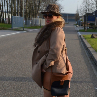 Busty Nude Chrissy goes for a naturist walk wearing only a fur coat