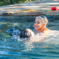 Spencer Scott and her Girlfriend get wet in a Pool