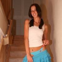 Brooke in a blue skirt on the stairs