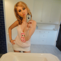 Blonde babe Molly Bennett does sexy selfshots in the bathroom