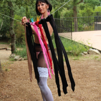 Sexy Desyra Noir posing in pantyhose and stockings outdoors