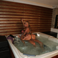 Tattooed European MILF pornstar Kayla Green riding cock in hot tub