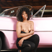 Hot black chick Misty Stone modeling solo for sexy topless photos