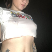 Redhaired girl with tattoos in a wet Tshirt