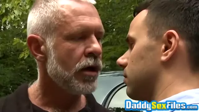 Horny stud fucks mature man in missionary pose in public