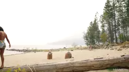 Angel Constance caresses her round Tits on a Beach