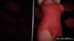 Nathaly Cherie masturbates in her red fishnet lingerie